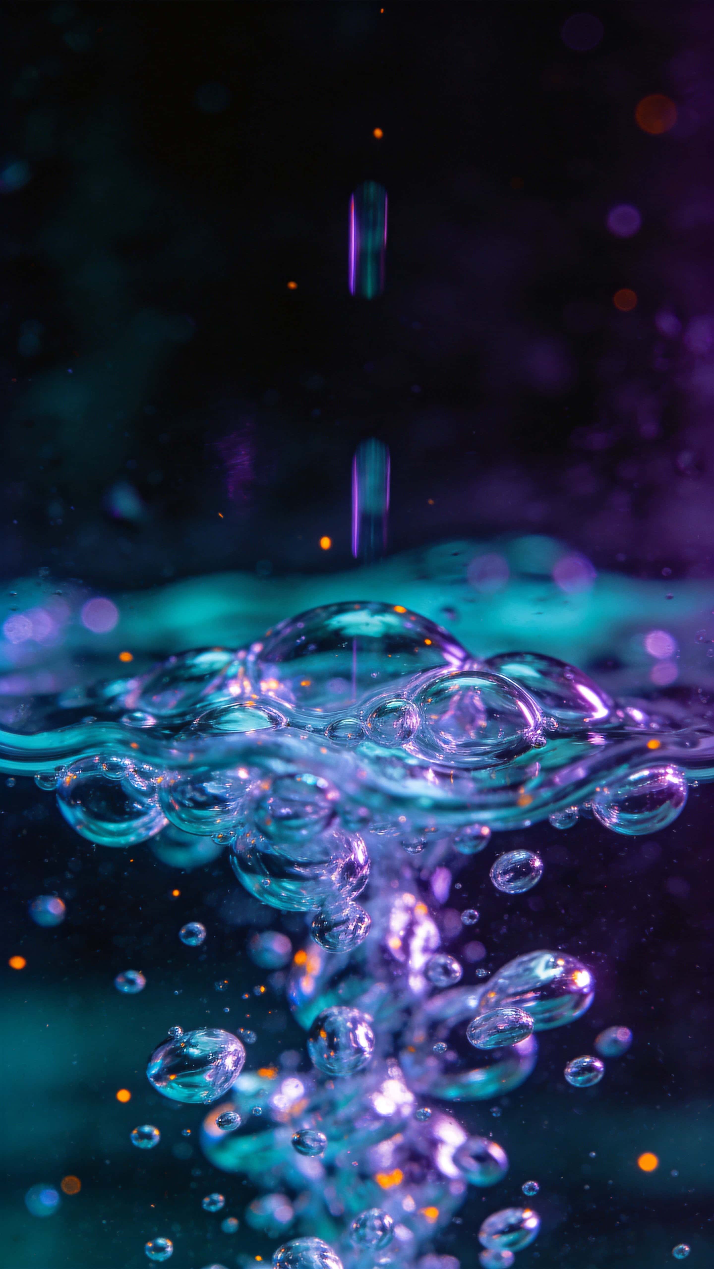 Abstract 9:16 macro close-up of glowing droplets clustered in the lower third against deep charcoal, refracting teal and violet neon with tiny orange highlights.