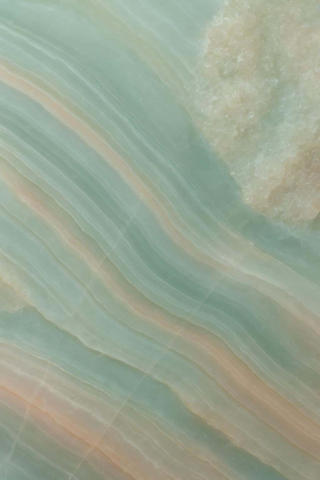 A vertical 2:3 macro of an agate slab filling the frame with diagonal veins, translucent banding and crystalline pockets, shallow focus, and a calm sea-green palette.