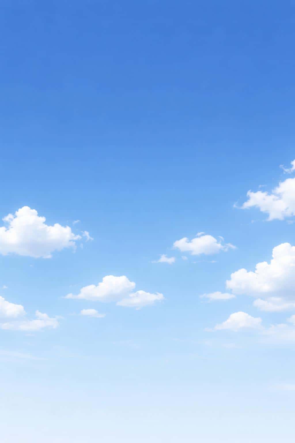 Crisp 2:3 landscape-photography of a clean blue sky with soft scattered white clouds, crafted for wallpaper or background use with calm, minimal atmosphere.