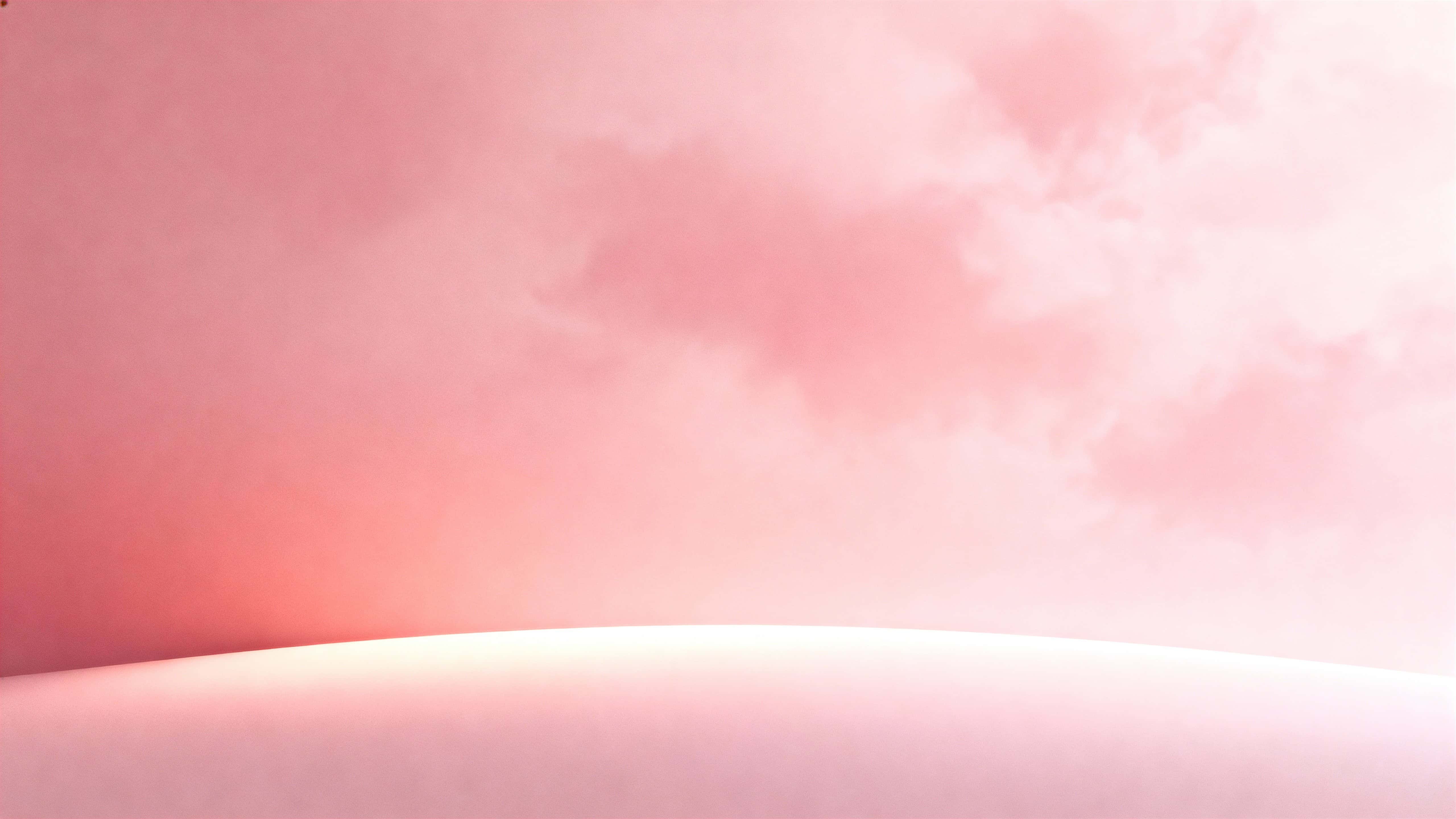 A tranquil 16:9 blush-pink 3D-rendered color field with a soft matte curve and seamless horizontal gradient from pale milky blush to warmer rose, with a diffuse luminous bulge below center.