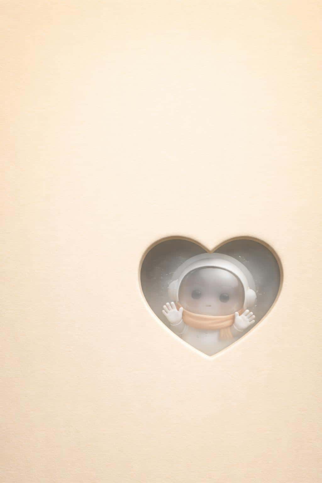 Portrait 2:3 minimalist wallpaper of a warm buttery gradient with paper grain, a beveled heart cutout revealing frosted glass and a peeking chibi astronaut.