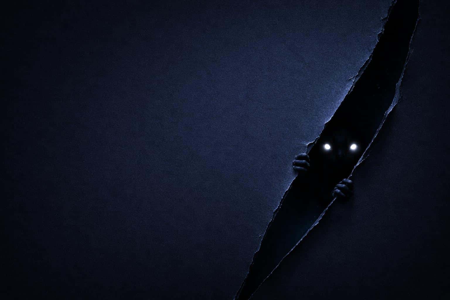 3:2 scene of a minimal midnight-blue field with left negative space; a diagonal tear at the right reveals a darker pocket where a small creature peeks, two dim glowing eyes visible.