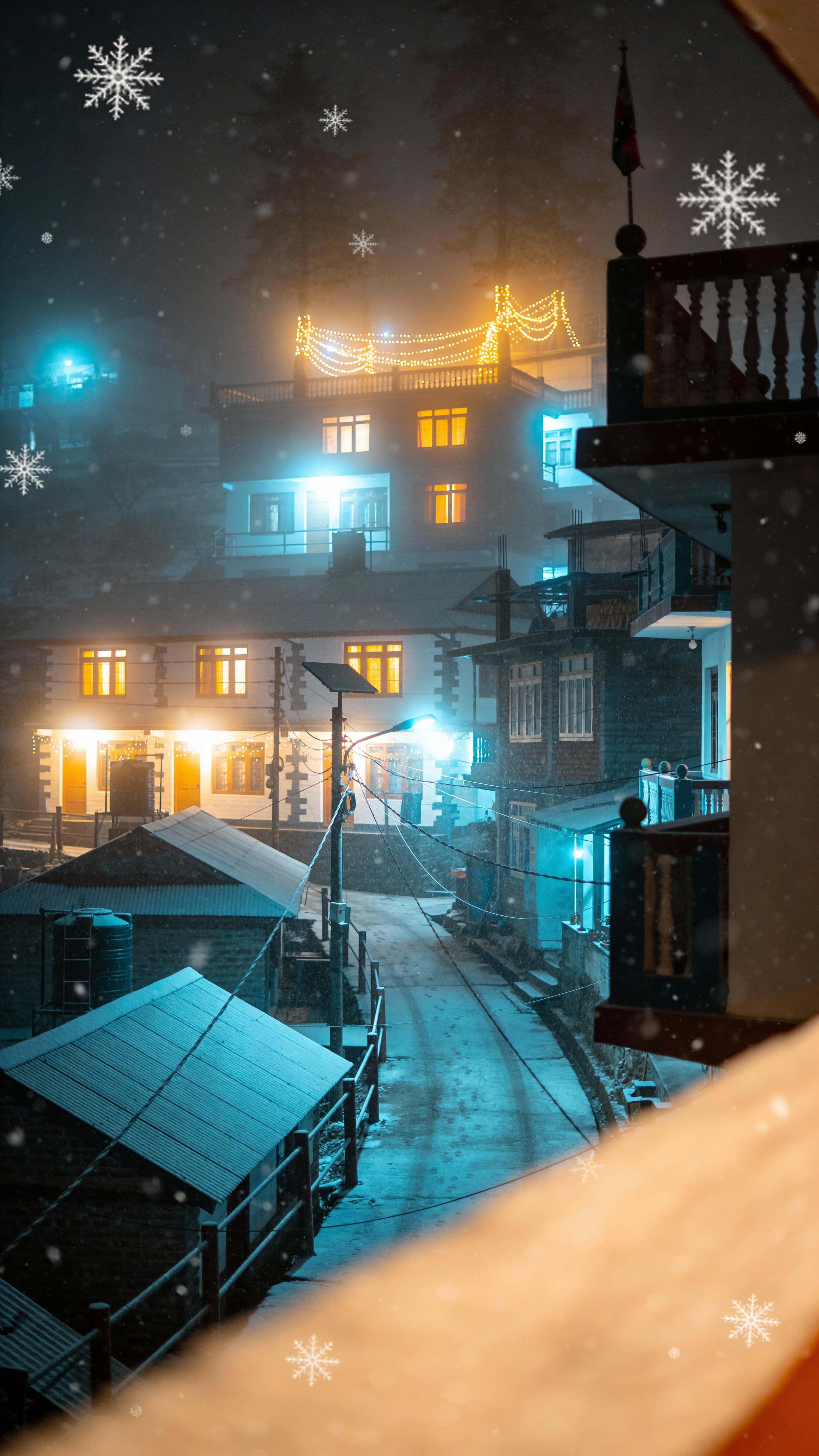 Portrait 9:16 view of foggy Darjeeling at Christmas night, vertical street with soft lamps glowing through mist and distant homestay windows warm amid gentle snowfall and cinematic depth.