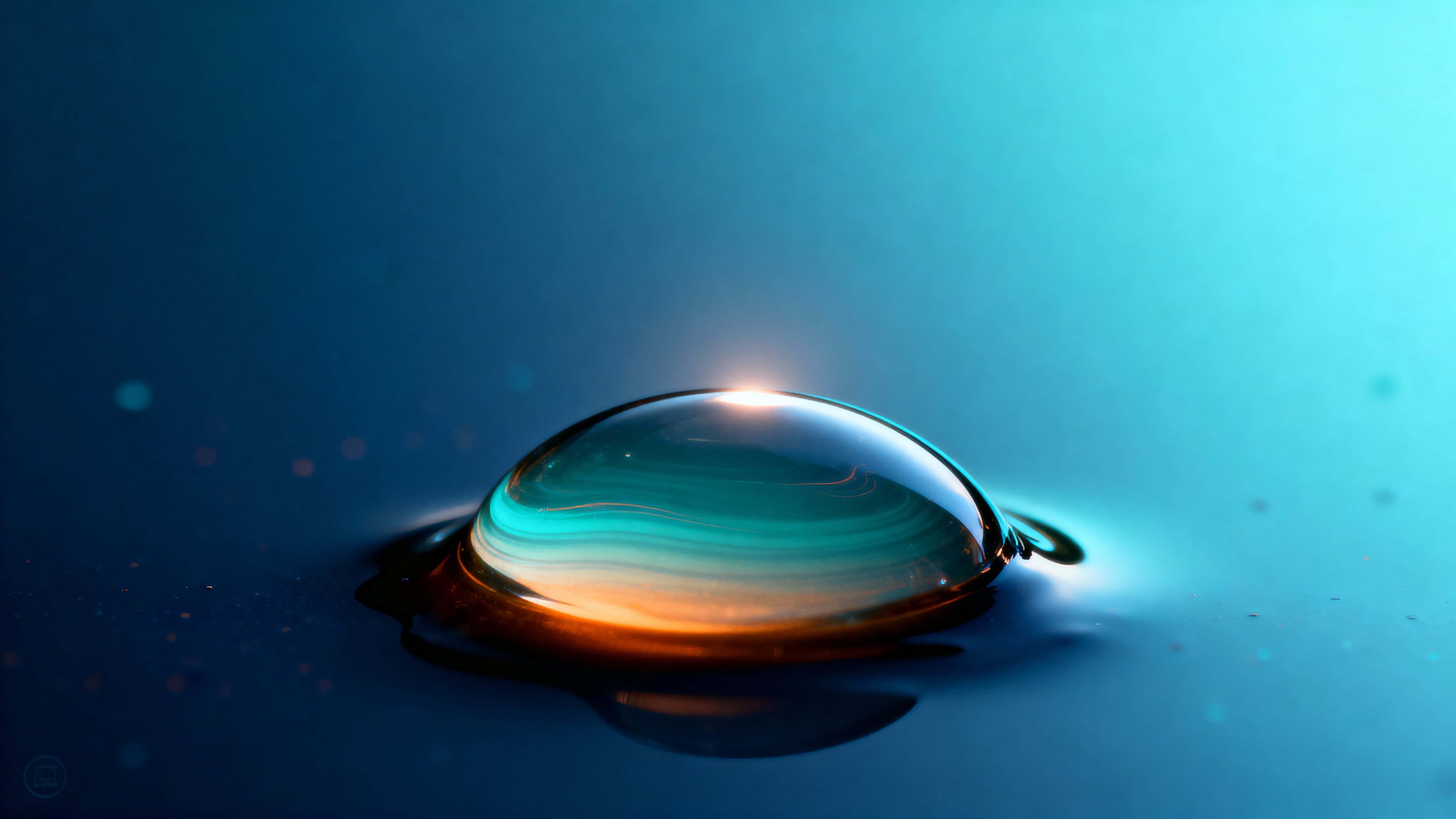 A single domed glass bubble rests near lower center over a deep navy and teal base, refracting layered teal-to-amber arcs with a soft cyan halo and subtle speckled shadows.