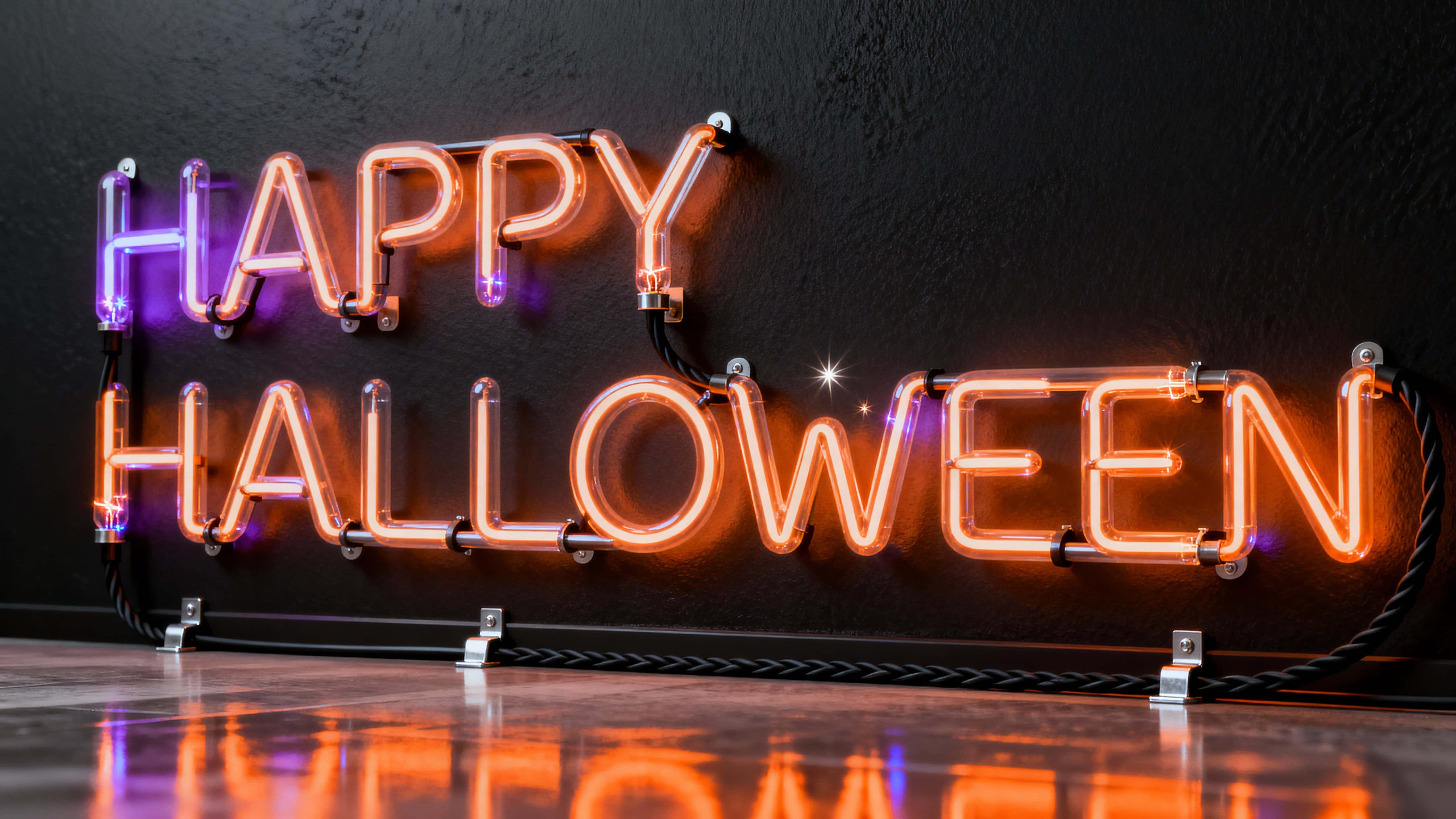 Bent glass neon tubes form a glowing "HAPPY HALLOWEEN" script with warm orange core and violet halo, slight joint flicker, faint volumetric haze, brushed-black wall and reflective floor creating a modern, moody display.