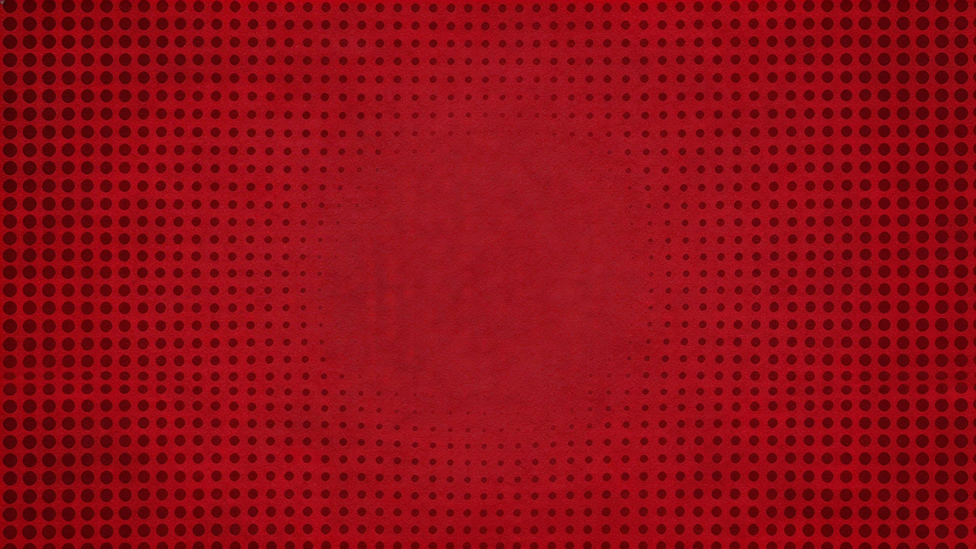 Widescreen 16:9 halftone dot field in deep red tones, seamless graphic print texture with controlled dot-scale gradient, smooth central fade, crisp edges and subtle paper grain.