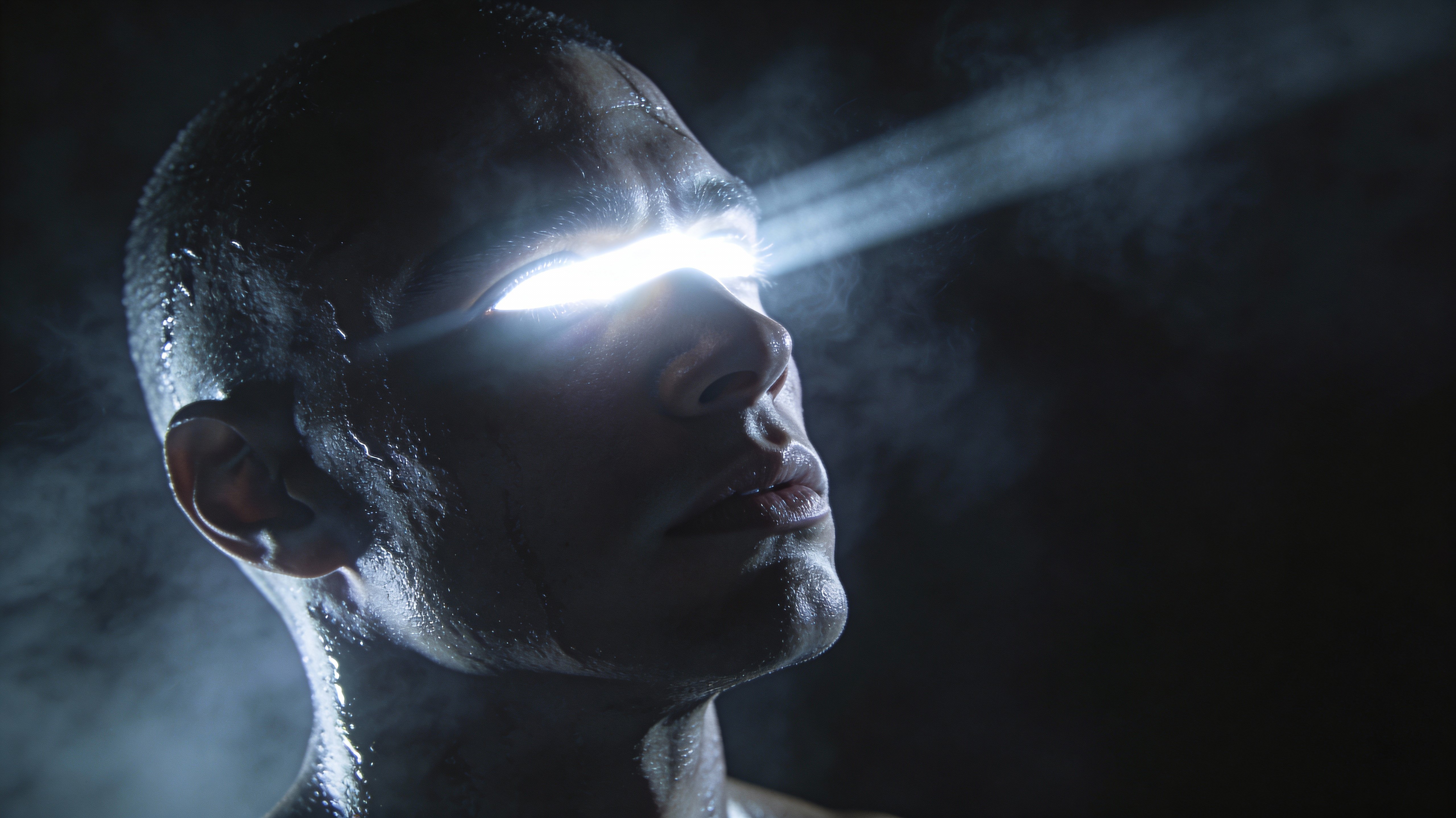 Cinematic sci‑fi portrait of a human figure gazing upward with a band of pure white light for eyes, wet skin, fogged atmosphere and dramatic low‑key mood suggesting a godlike awakening.