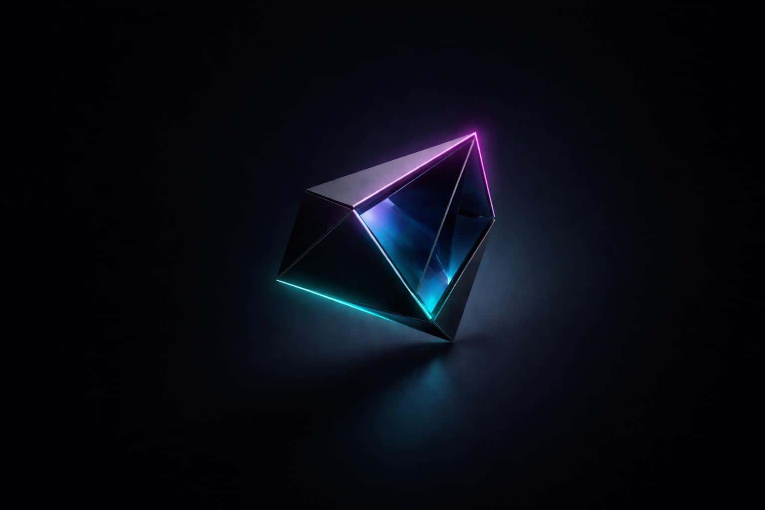 A single matte-black and glass geometric object floats off-center on a deep navy-black desktop wallpaper with magenta-to-cyan rim glow, teal reflections, and soft haze.