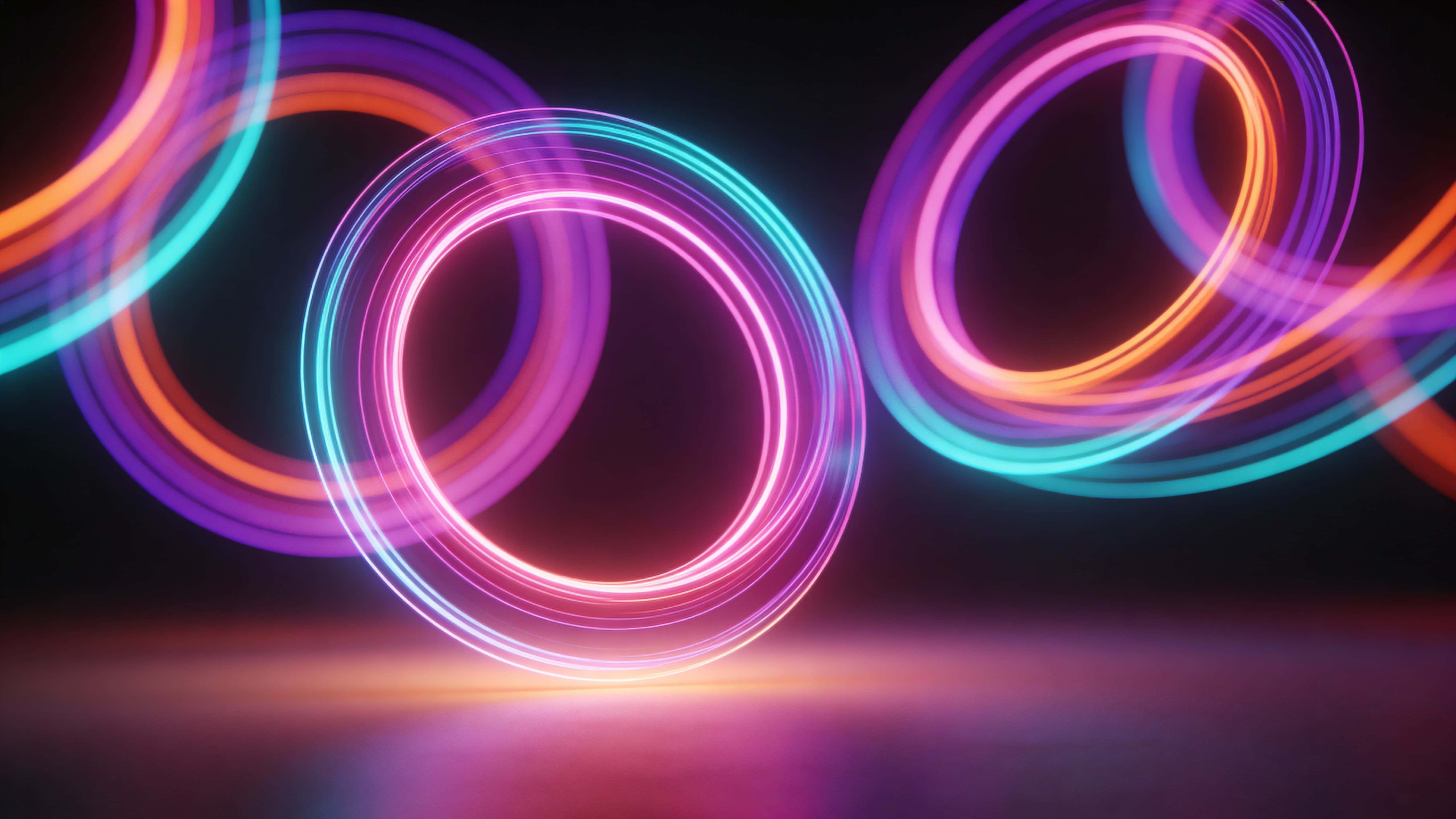 Sleek abstract composition of luminous neon rings rotating gently in dark space with saturated pink, purple, cyan, and orange bands blending over a soft base glow.