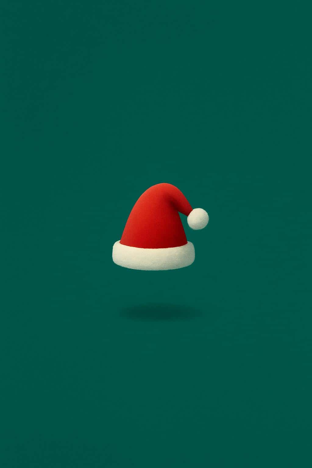 Minimal conceptual artwork showing a small plush Santa hat floating centered within a vast emerald-green vertical 2:3 field, smooth curves, soft plush texture and a subtle shadow beneath it.