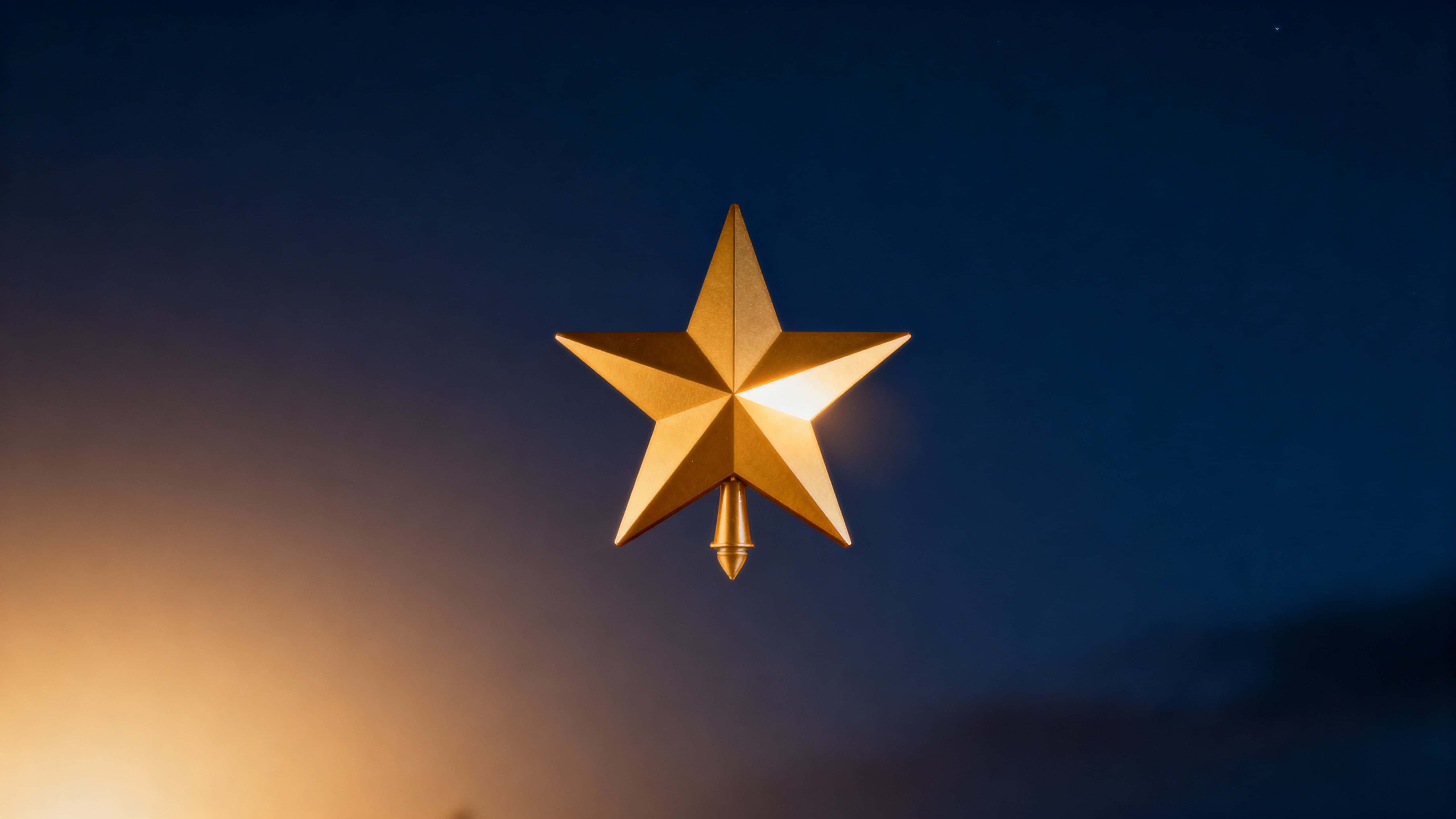 A single warm-gold five-point star tree topper floats slightly above center against a deep midnight-blue gradient, with soft lower-left glow and open copy space.